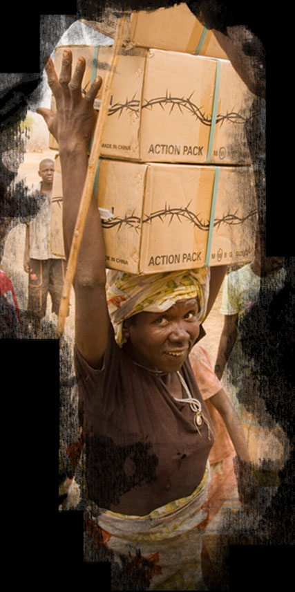 Woman with boxes balanced on her head, smiling